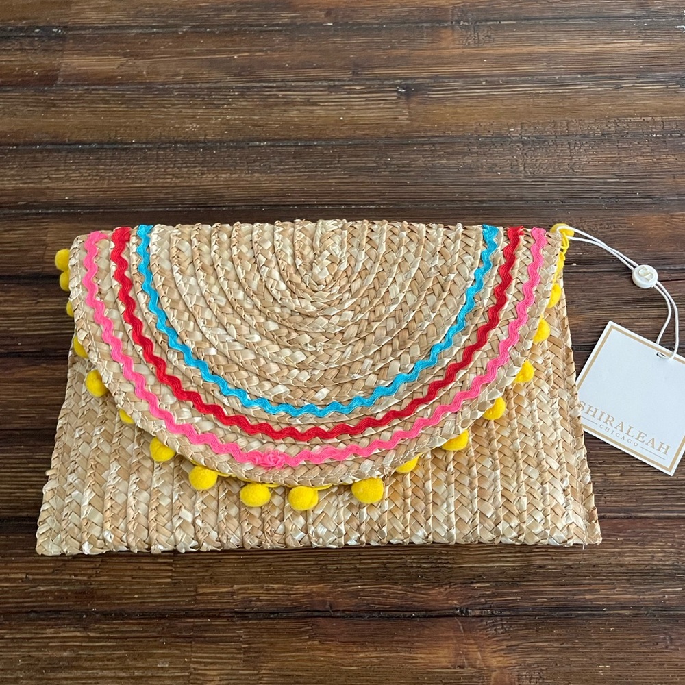 Colorful clutch with poms